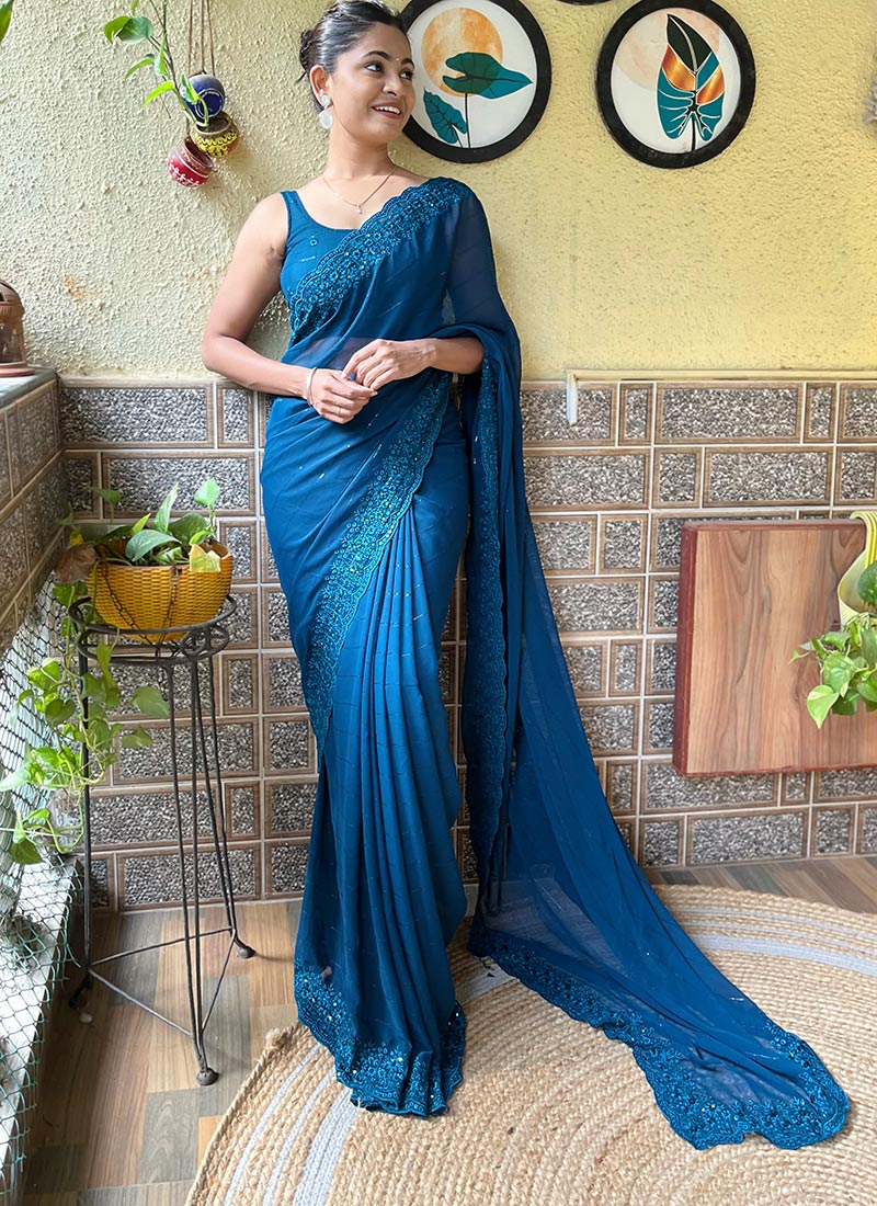 Effortless Elegance In Teal Green Faux Georgette Embroidered Saree