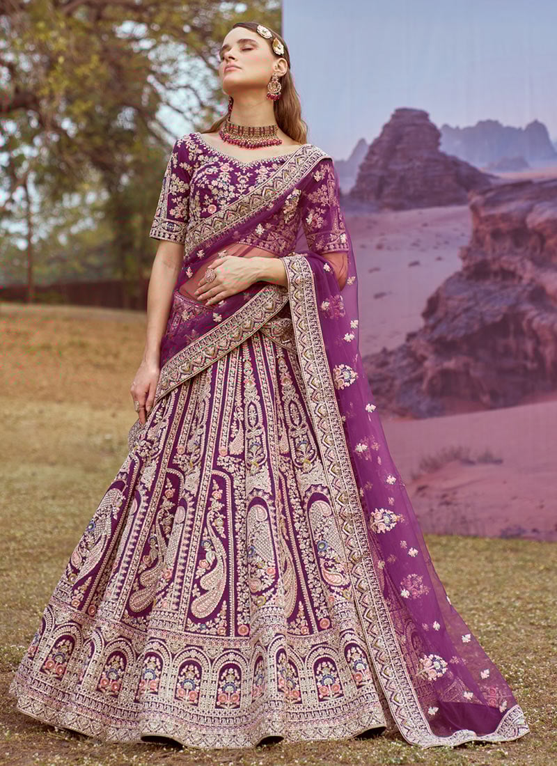 Embrace Royal Elegance In A Purple Silk Zarkan Embroidered Moti Lehenga Wedding Wear