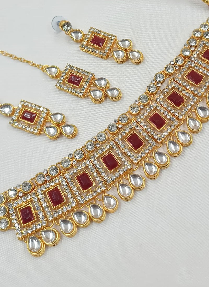 Golden Plated Kundan Necklace With Maroon Stone