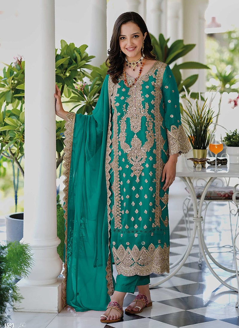 Pakistani Straight Pant Suit In Teal Green Organza With Sequin And Stone Embellishments Festive Wear