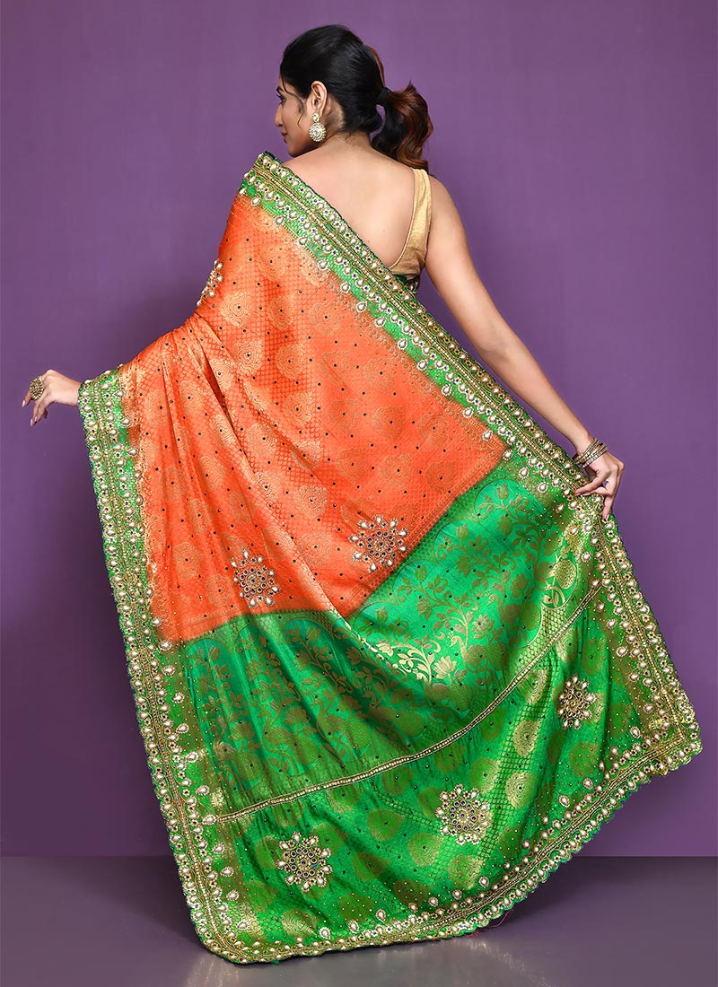 Orange zari buttas Kanchipuram silk saree, contrast floral design border, and pallu of manga designs