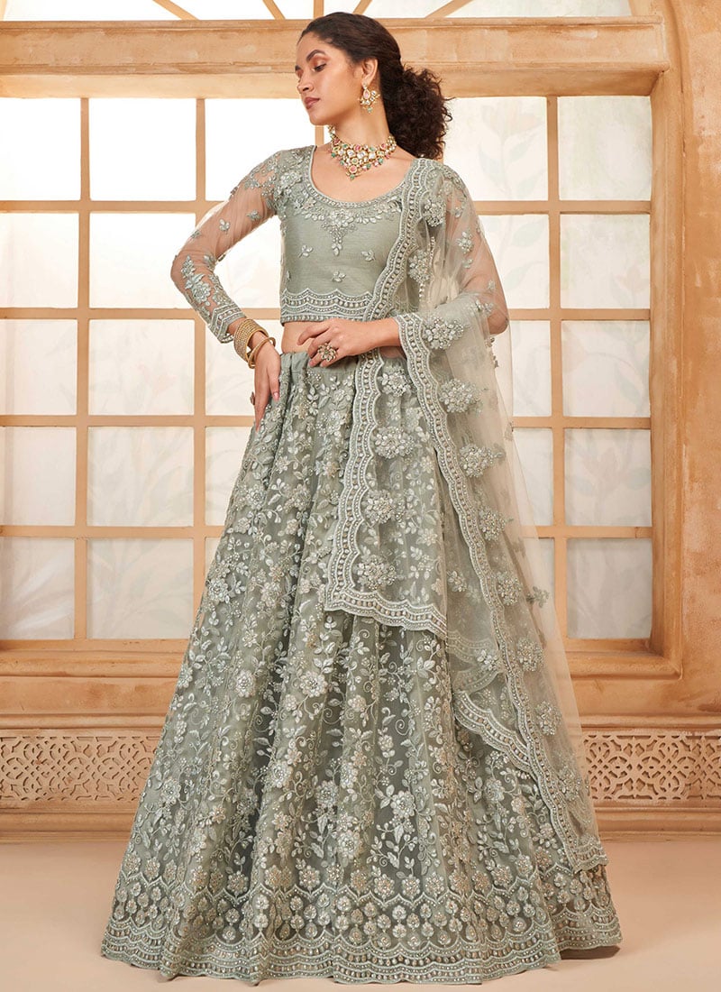 Radiate In Dusty Green Net Embroidered Stone Work Lehenga Wedding Wear