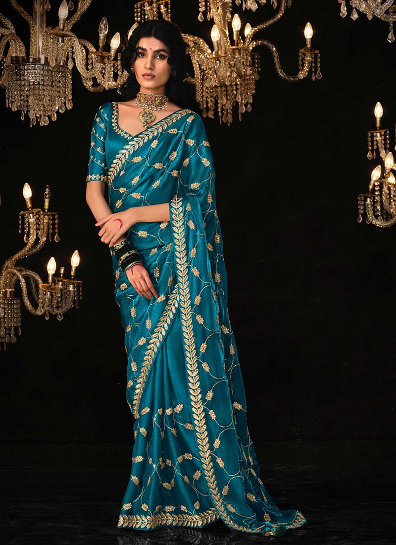 Shimmering Tradition Teal Blue Tissue Silk Zari Embroidered Sequins Saree Festive Wear