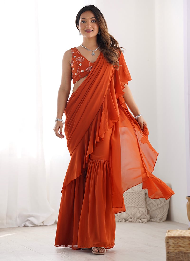 Vibrant Orange Georgette Sharara Style Pre Draped Saree With Ruffled Elegance Festive Wear