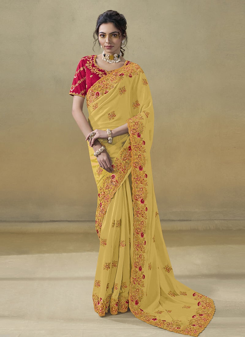 Yellow Georgette Embroidered Stones And Zari Saree Wedding Wear